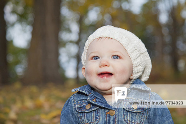 Portrait Of A Baby Girl In A Park In Autumn  Edmonton  Alberta  Canada