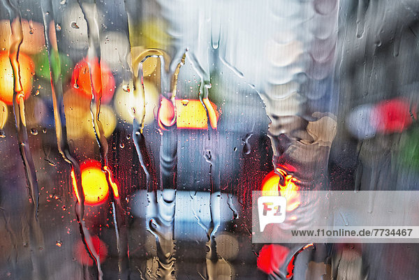 View Of A Car's Tail Lights Through A Wet Windshield  Amsterdam  Holland