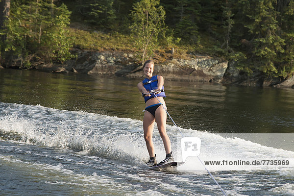 A Girl Wakeboarding  Keewatin Ontario Canada