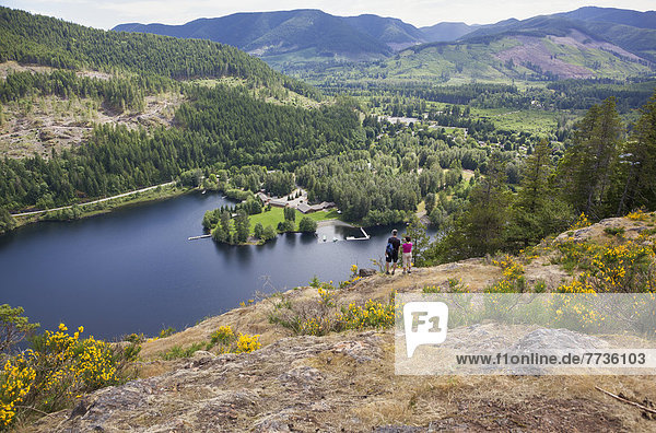 A Senior Couple Overlook Cowichan Lake On Vancouver Island  British Columbia Canada