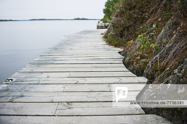 Boardwalk along a lake shoreline  kenora ontario canada