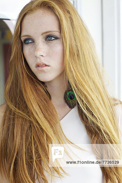 Portrait of a young woman with long red hair  kauai hawaii united states of america