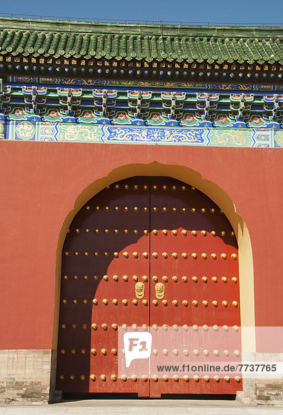 Ornate and colourful architecture of an arched doorway Forbidden city beijing china