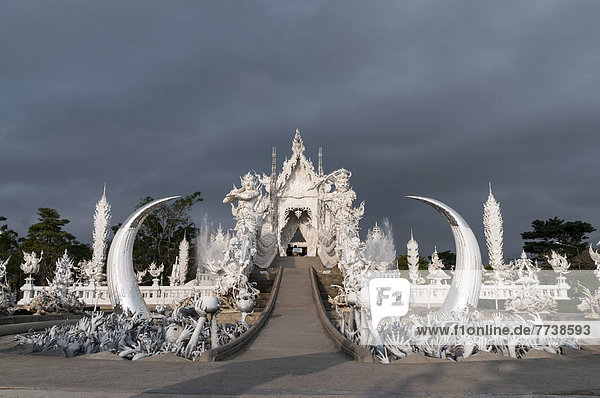 Wat Rong Khun temple or The White Wat a Buddhist-Hindu temple by architect Chalermchai Kositpipat