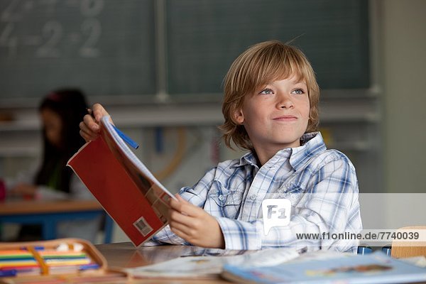 Primary School Child with Exercise Book