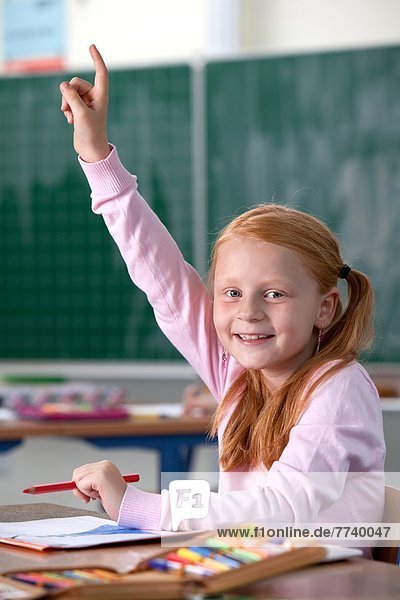 Primary School Child is Raising her Hand