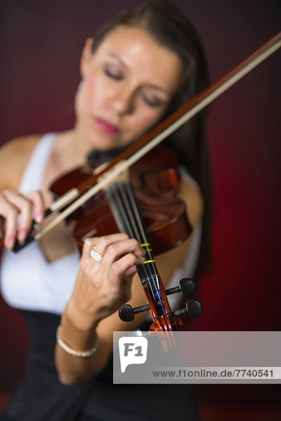 Young woman playing violin