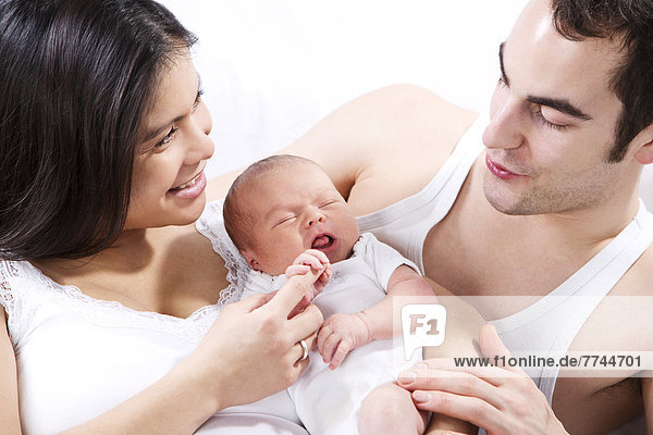 Parents with baby boy  smiling