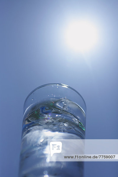 Glass of water and blue sky