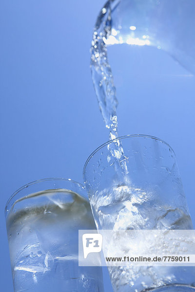 Two glasses of water and blue sky