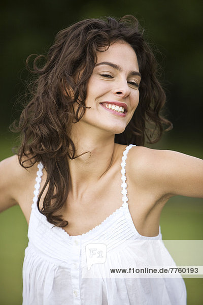 Young woman smiling  oudoors
