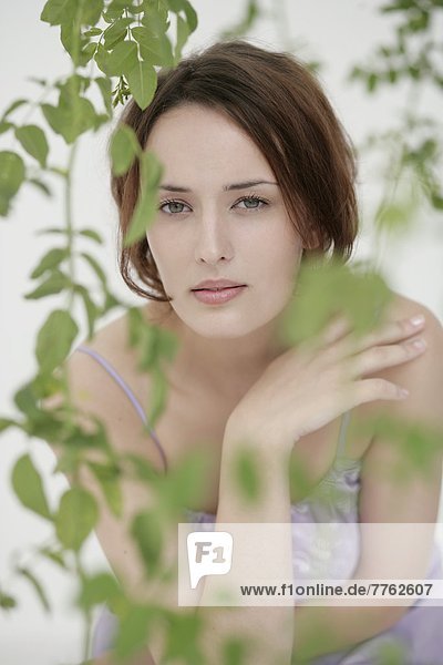 Portrait of a woman with plants