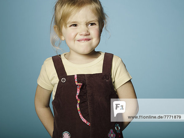 Portrait of little girl making a face