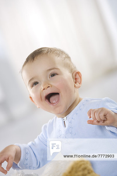 Portrait of baby boy laughing