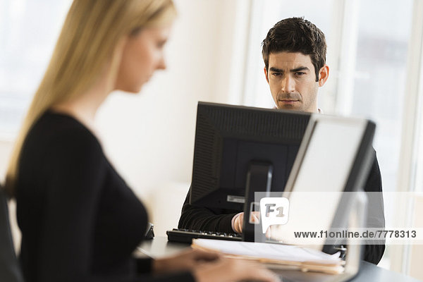 Business man and woman working in office