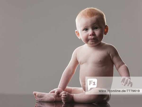 Studio Shot Of Naked Baby Boy 18 23 Months Sitting