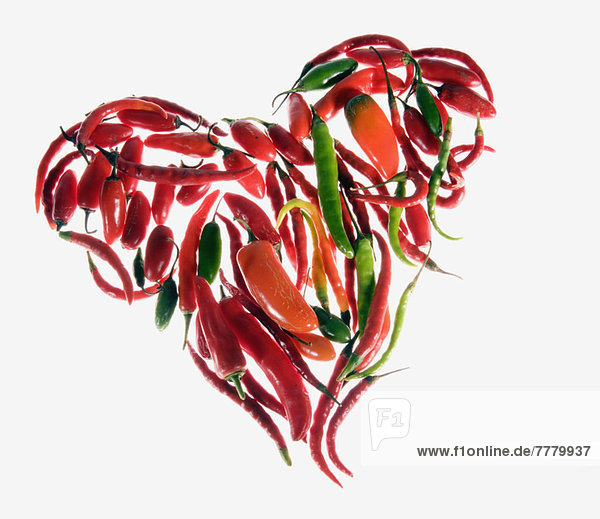 Different Kind of peppers arranged in shape of heart