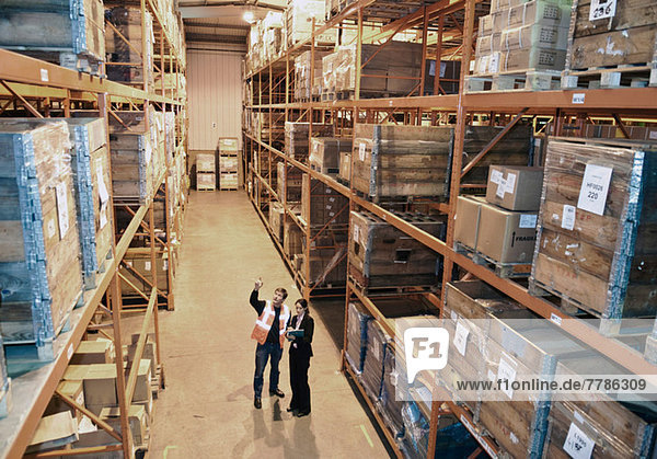 Worker and supervisor in warehouse