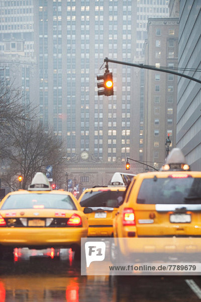 Yellow cabs at traffic lights  New York City  USA