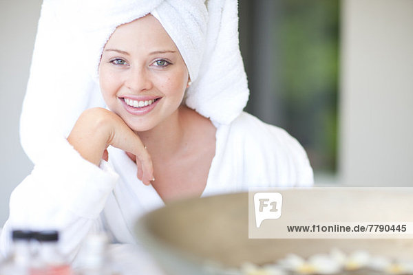 Young woman wearing towel on head