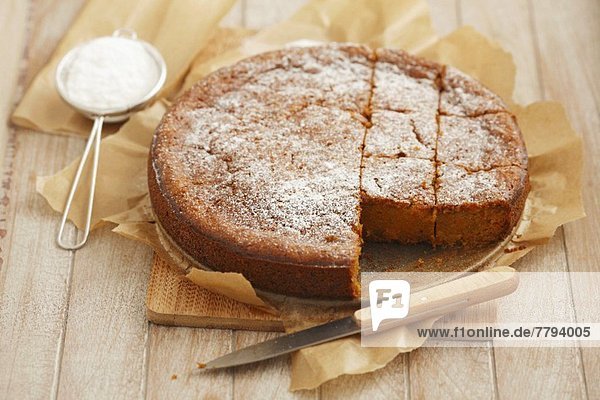 Carrot cake topped with icing sugar