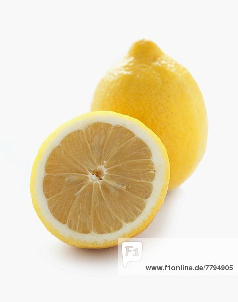 Half and Whole Lemon on White Background