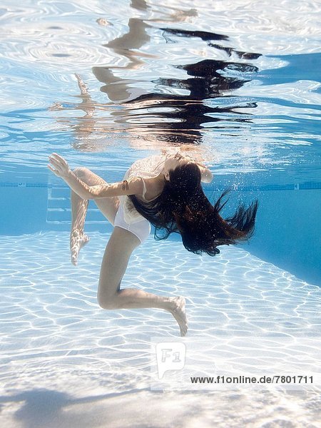 USA Utah Orem Young woman in pool ballet dancing