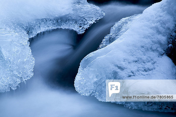 Ice formations in a mountain stream in winter