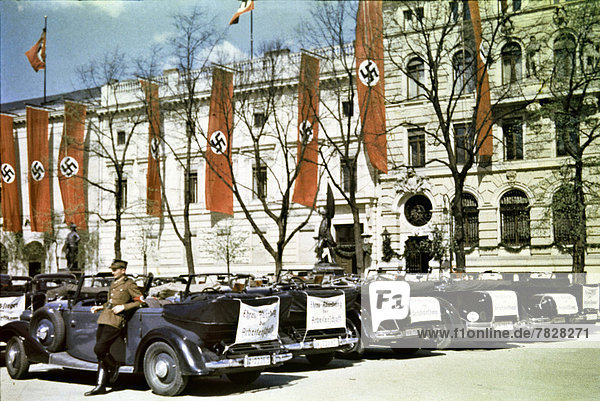 Third Reich  Nazi  National Socialist  national socialism  Germany  prewar  Berlin  Europe  1st May  holiday  town jubilee  1937  place  swastika  flags  buildings  constructions  vehicle  car  driver  uniform