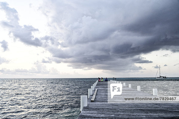 San Pedro  Belize  Central America  Caribbean  San Pedro  Amergris  Caye  Cays  Cay  pier  clouds  stormy  sunrise  tropical