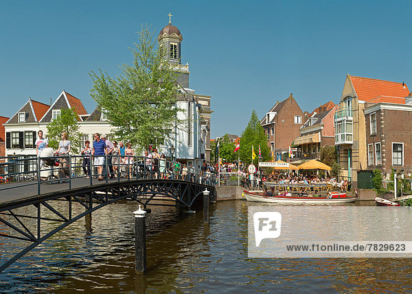 Netherlands  Holland  Europe  Leiden  Footbridge  bridge  canal  city  village  water  spring  people
