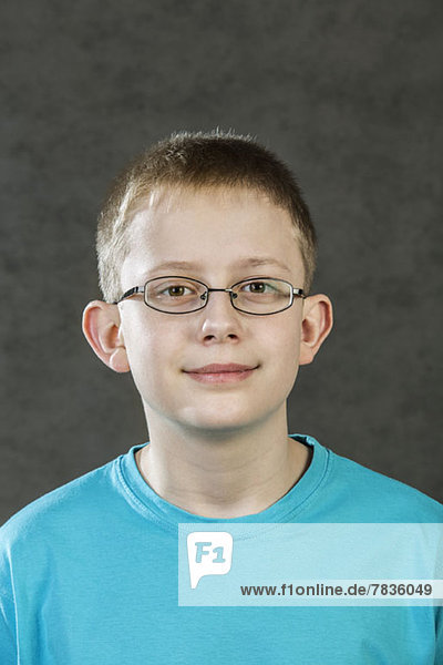 Portrait of boy wearing glasses