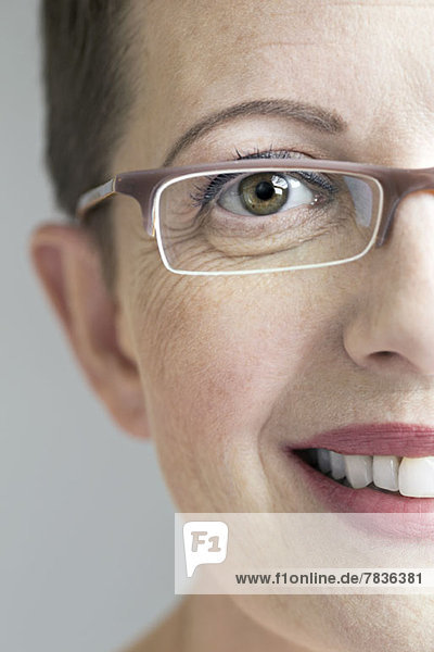 Close up of smiling woman with glasses