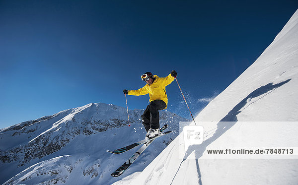 Austria  Salzburg  Mature man skiing in mountain of Altenmarkt Zauchensee