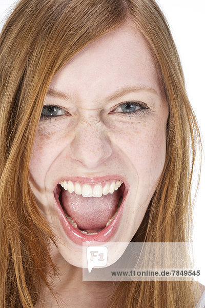 Portrait of young woman shouting  close up