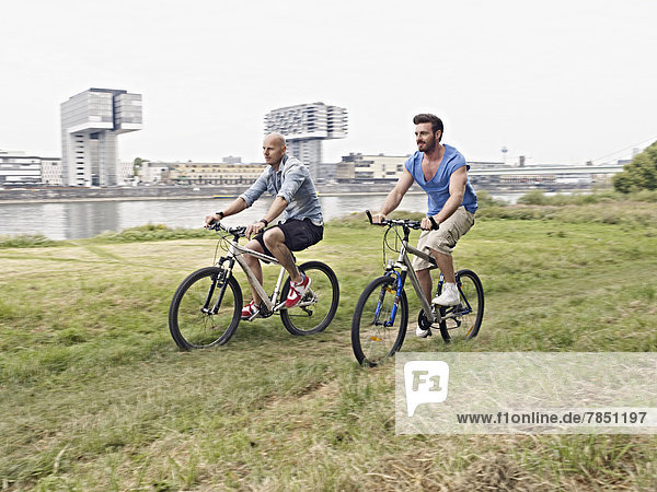Men riding bicycle