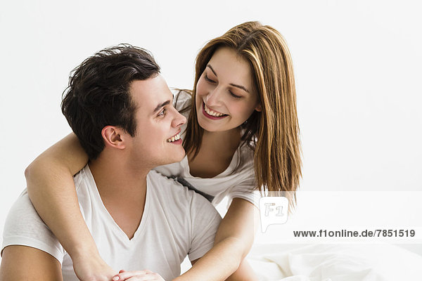 Young couple embracing each other  smiling