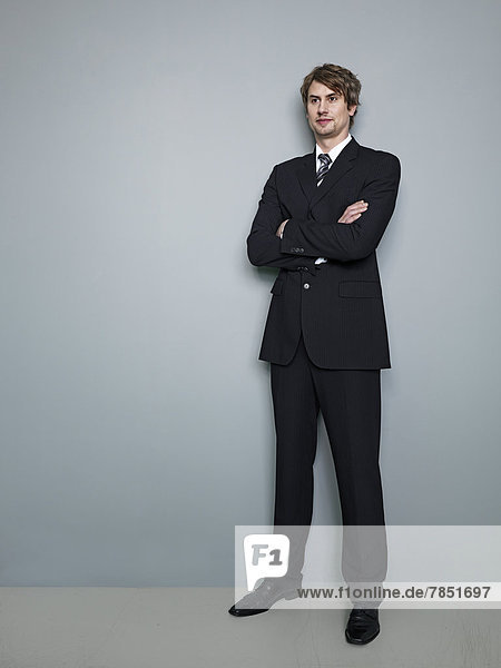 Businessman standing with arms crossed
