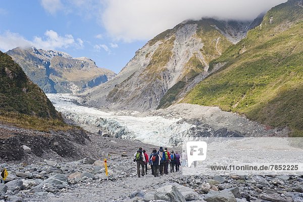 Tourists on Fox Glacier tour  Westland National Park  UNESCO World Heritage Site  South Island  New Zealand  Pacific