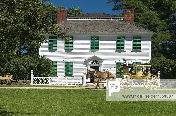 Horse drawn stagecoach at Old Sturbridge Village  a living history museum depicting early New England life from 1790 to 1840 in Sturbridge  Massachusetts  New England  United States of America  North America