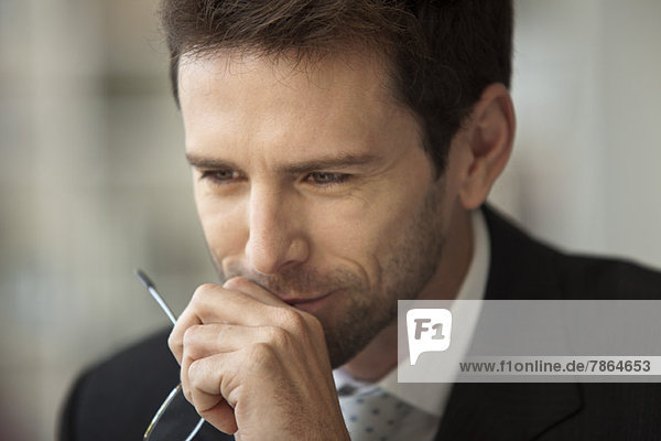 Businessman looking away in thought