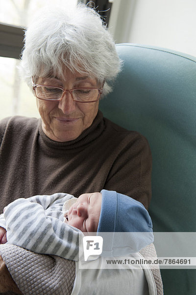 Grandmother holding newborn baby