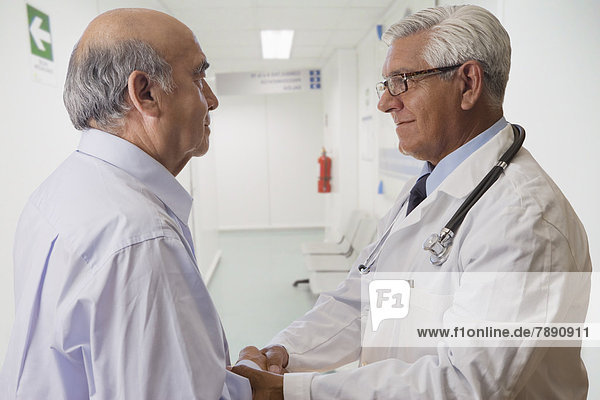 Hispanic doctor talking with patient