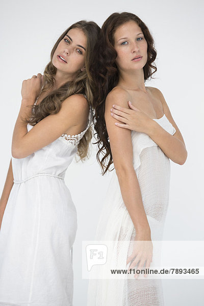 Portrait of two female friends posing