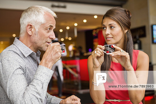 Couple enjoying cup of tea in a restaurant