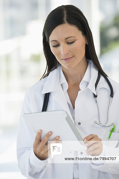 Female doctor using a digital tablet
