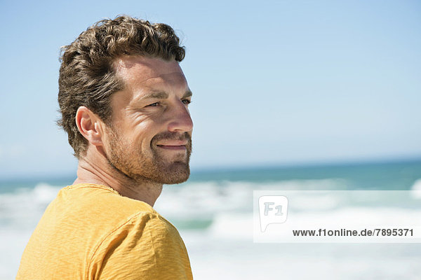 Man smiling on the beach