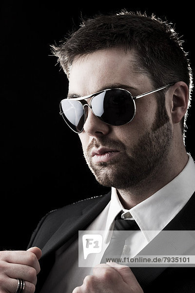 Man wearing sunglasses with stubble  portrait