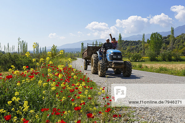 Tractor driving on a country road