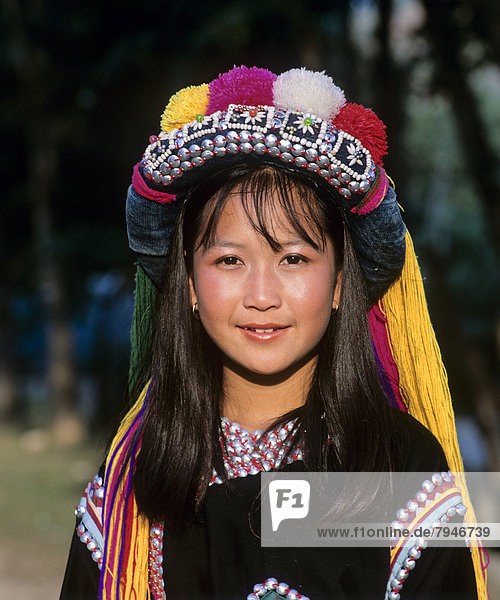 Lisu girl wearing a colourful headdress and the traditional costume of the mountain people  portrait